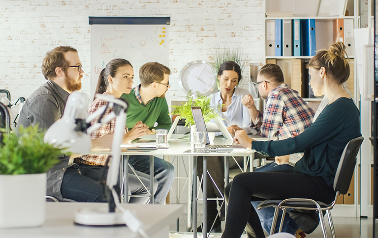 Group of marketing professionals working on a strategy.