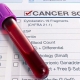 Blood test for cancer lays on medical form for cancer screening