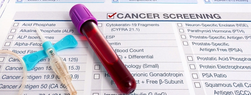 Blood test for cancer lays on medical form for cancer screening